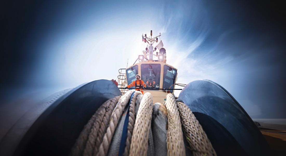Cargo ship seen from above sailing in the ocean. Cargo ship seen from above sailing in the ocean.